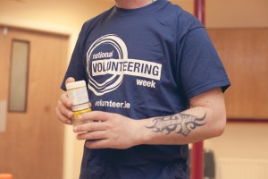 Photo of a young man holding paint